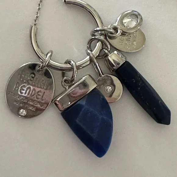 Henri Bendel  silver tone necklace with dark blue crystal and logo charms disc - Picture 9 of 9